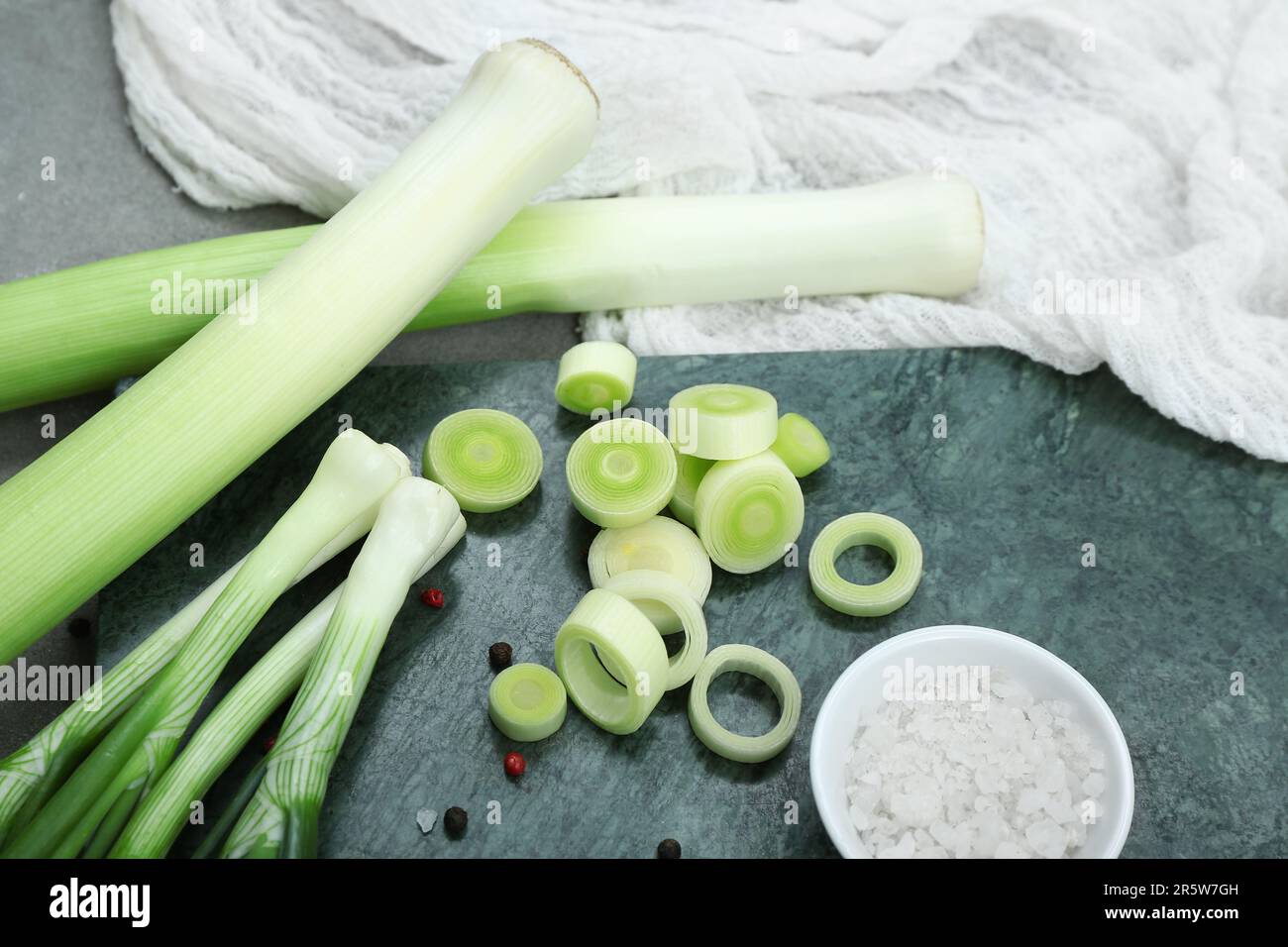 Board with different kinds of onion on grunge grey background Stock ...