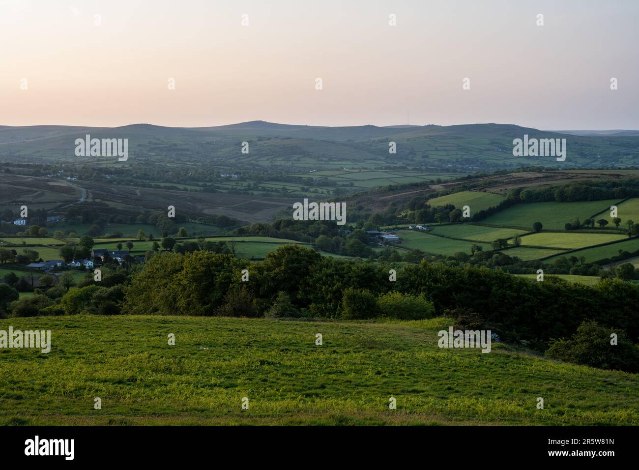 Morning sun shines on the Tavy Valley and the hills of Dartmoor as seen from Brent Tor hill in West Devon. Stock Photo