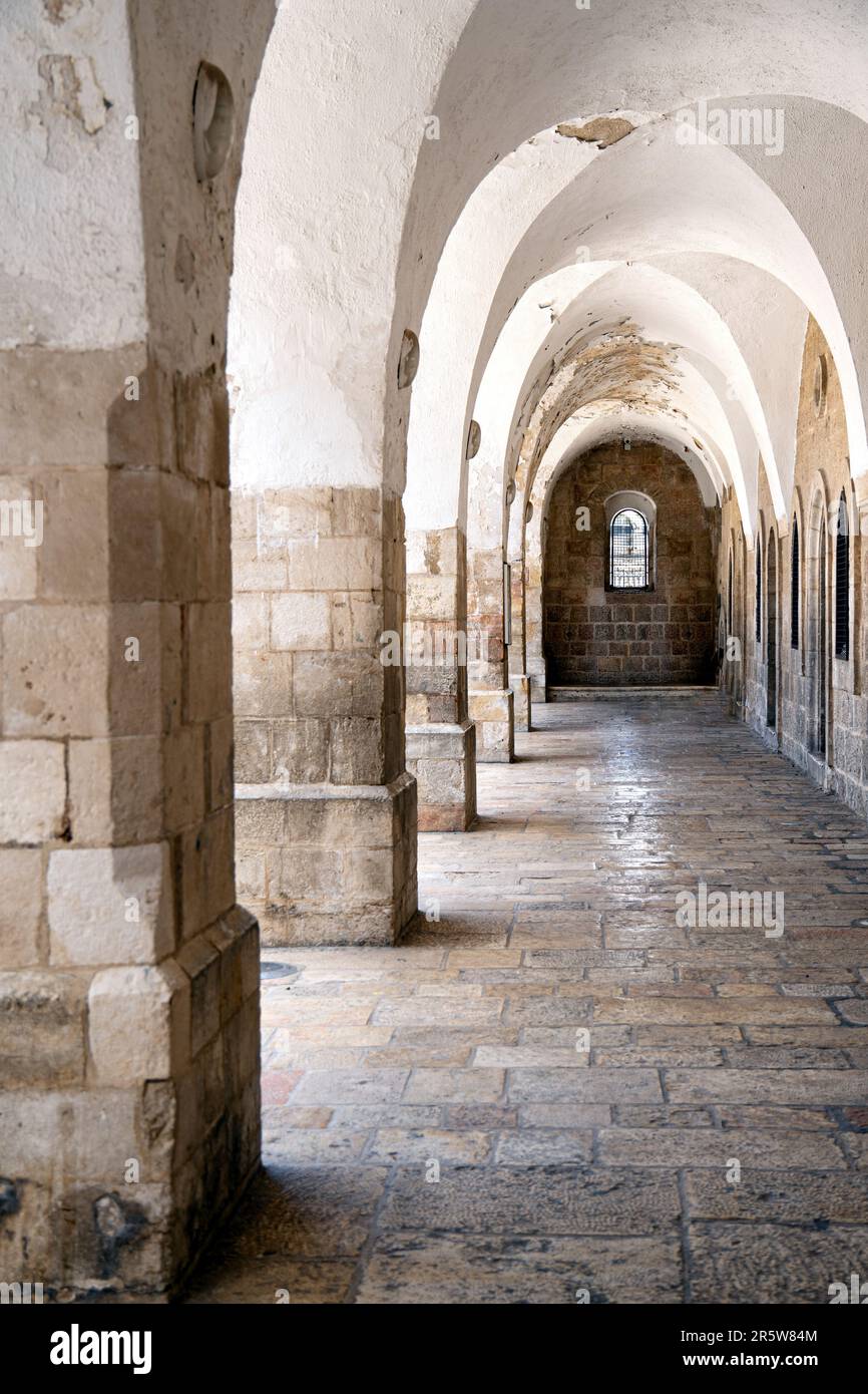 Gallery with pillars and arches in ancient building Stock Photo Alamy