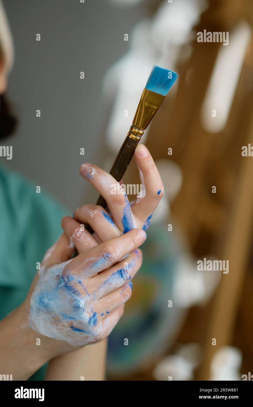 Female artist holding paint brush hi-res stock photography and images ...
