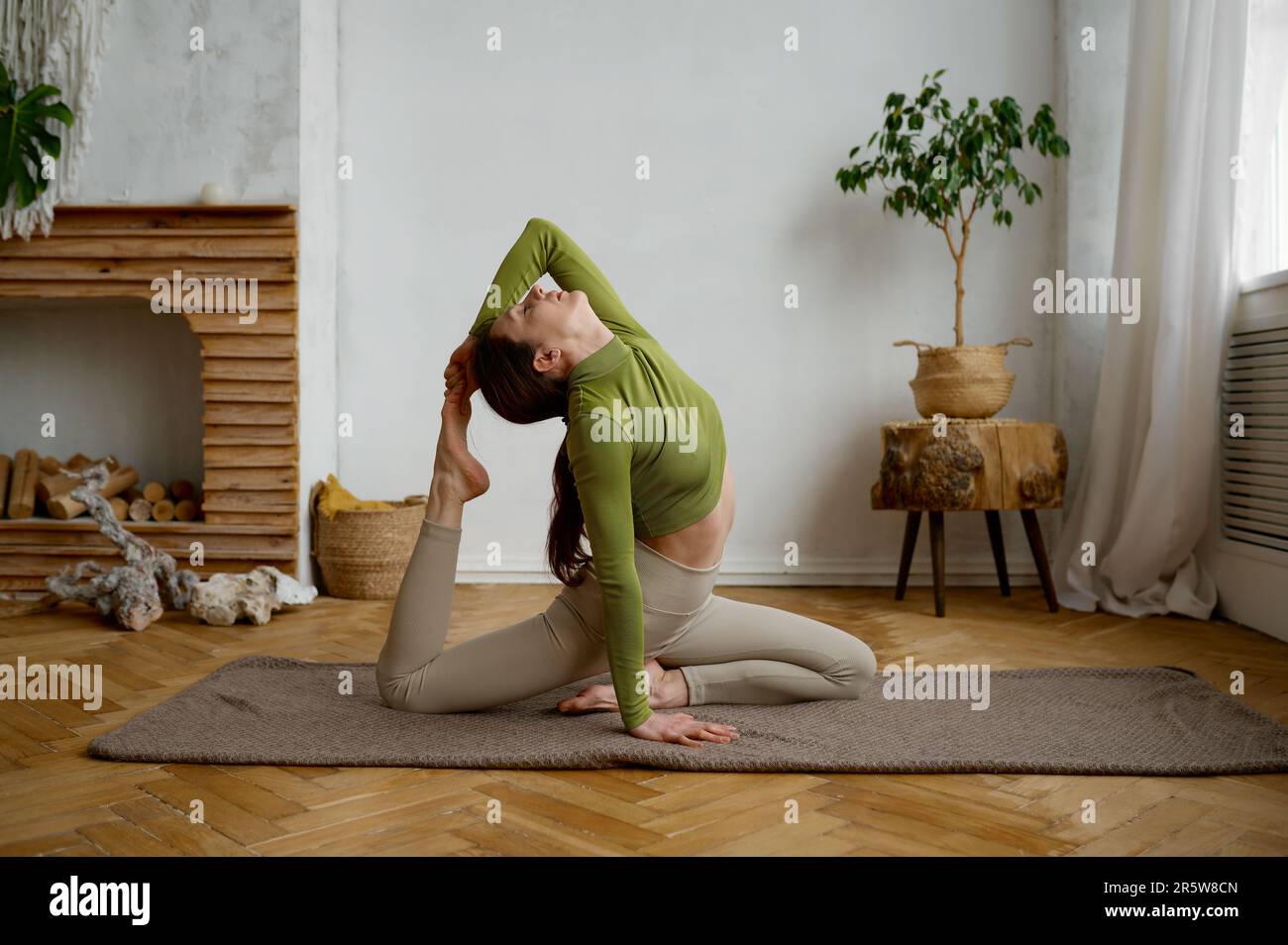 Woman doing leg stretching hi-res stock photography and images - Alamy
