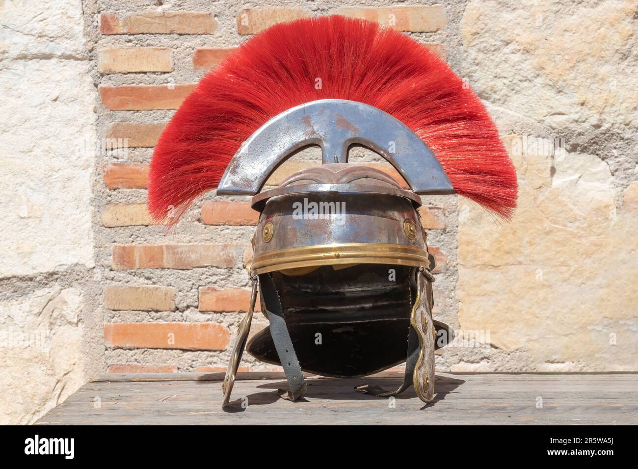 horizontal view of a roman centurion helmet with red plume A Roman