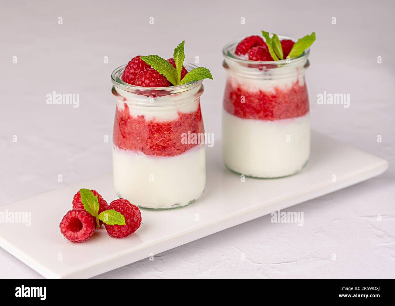 Food photography of breakfast, cottage cheese, cream, ricotta, greek yogurt, raspberry, creamy