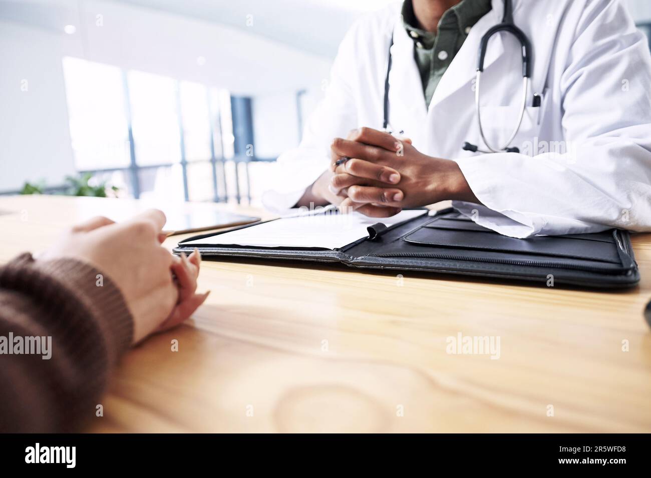 These tests wont take too long. an unrecognizable doctor sitting with