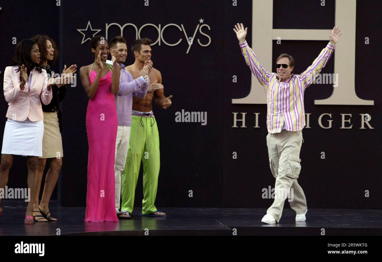 tommy11 112 pc.JPG Fashion designer Tommy Hilfiger (right) accepts the  applause from his models and from the Union Square crowd at the end of the  show. Tommy Hilfiger debuts his "H Hilfiger"
