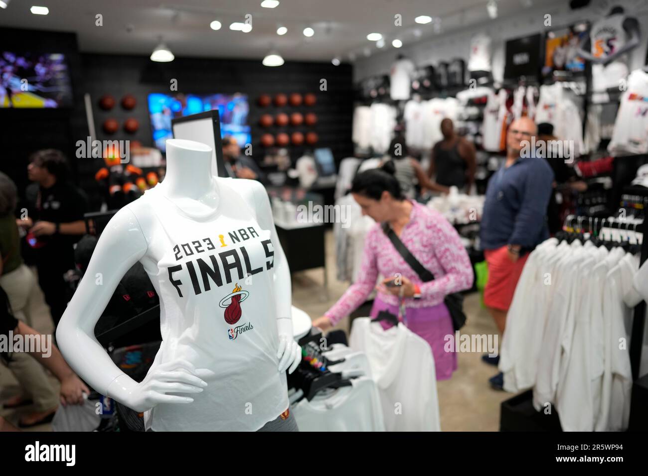 A woman shops for Miami Heat basketball team gear for young fans, Monday,  June 5, 2023, at the official Miami Heat Store at Dadeland Mall in Miami.  The Heat will next face