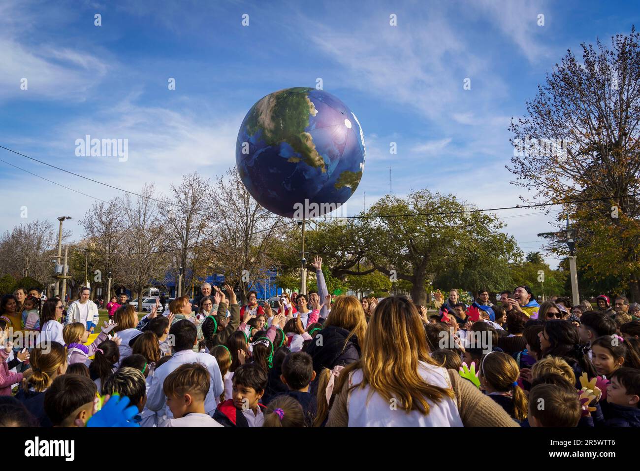 Firmat, Argentina. 05th June, 2023. Children of every school in Firmat play with a giant Planet Earth balloon as part of activities commemorating the World Environment Day. Firmat is home of the world's first Eco Club, Patrulla Ambiental (Environmental Patrol), founded 30 years ago by a group of primary school children and still active today raising awareness on environmental issues. Credit: SOPA Images Limited/Alamy Live News Stock Photo