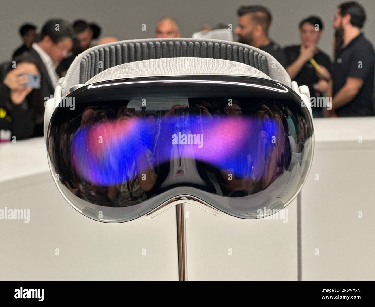 Cupertino, USA. 05th June, 2023. Media representatives and bloggers surround the Apple Vision Pro computer glasses on display in the Steve Jobs Theater on Apple's corporate campus in Cupertino. The novel headset had previously been presented by Group CEO Cook at Apple's WWDC developer conference. Credit: Christoph Dernbach/dpa/Alamy Live News Stock Photo