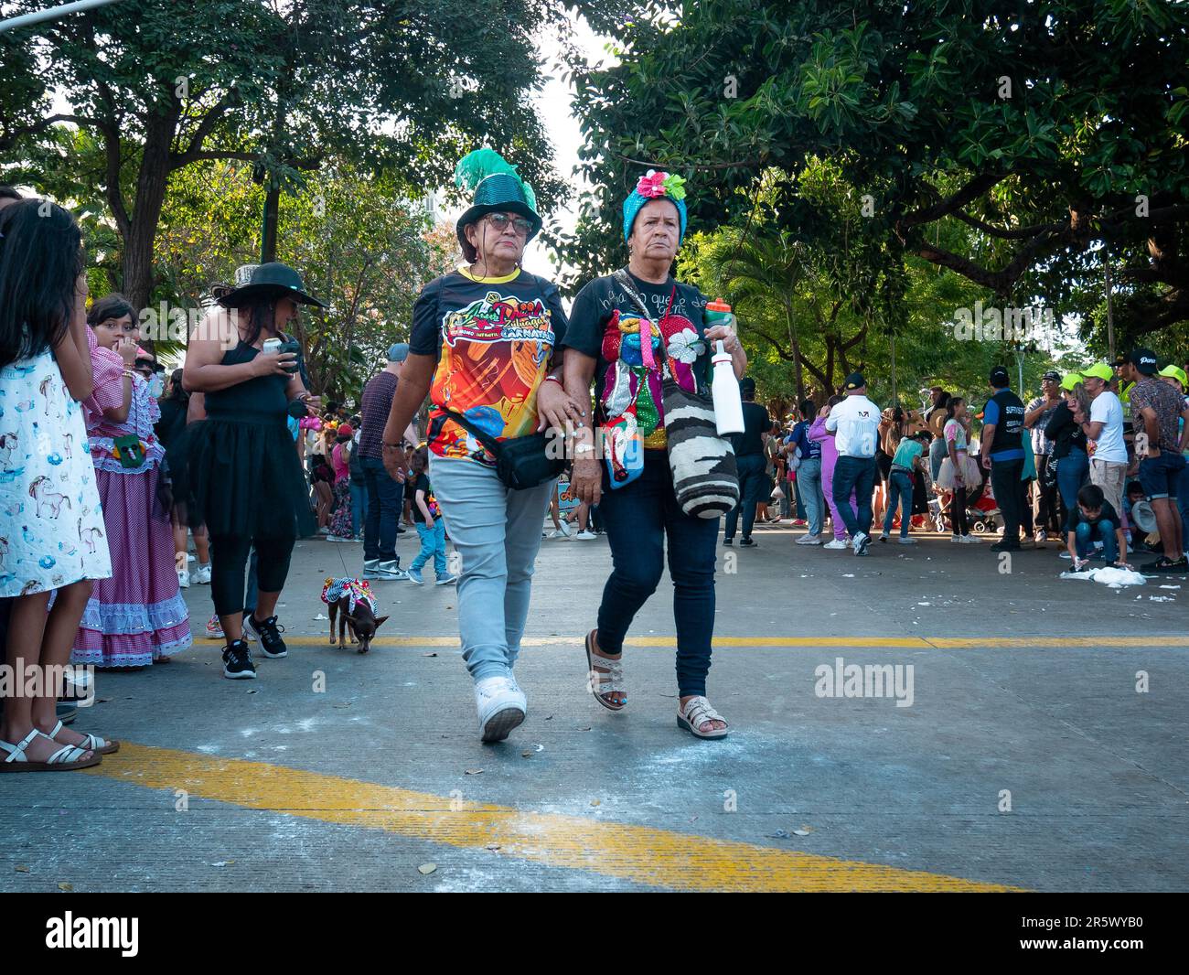 Barranquilla, Atlantico, Colombia - February 21 2023: Colombian Women Walk Down Parade Street on the Last Day of Carnival Stock Photo