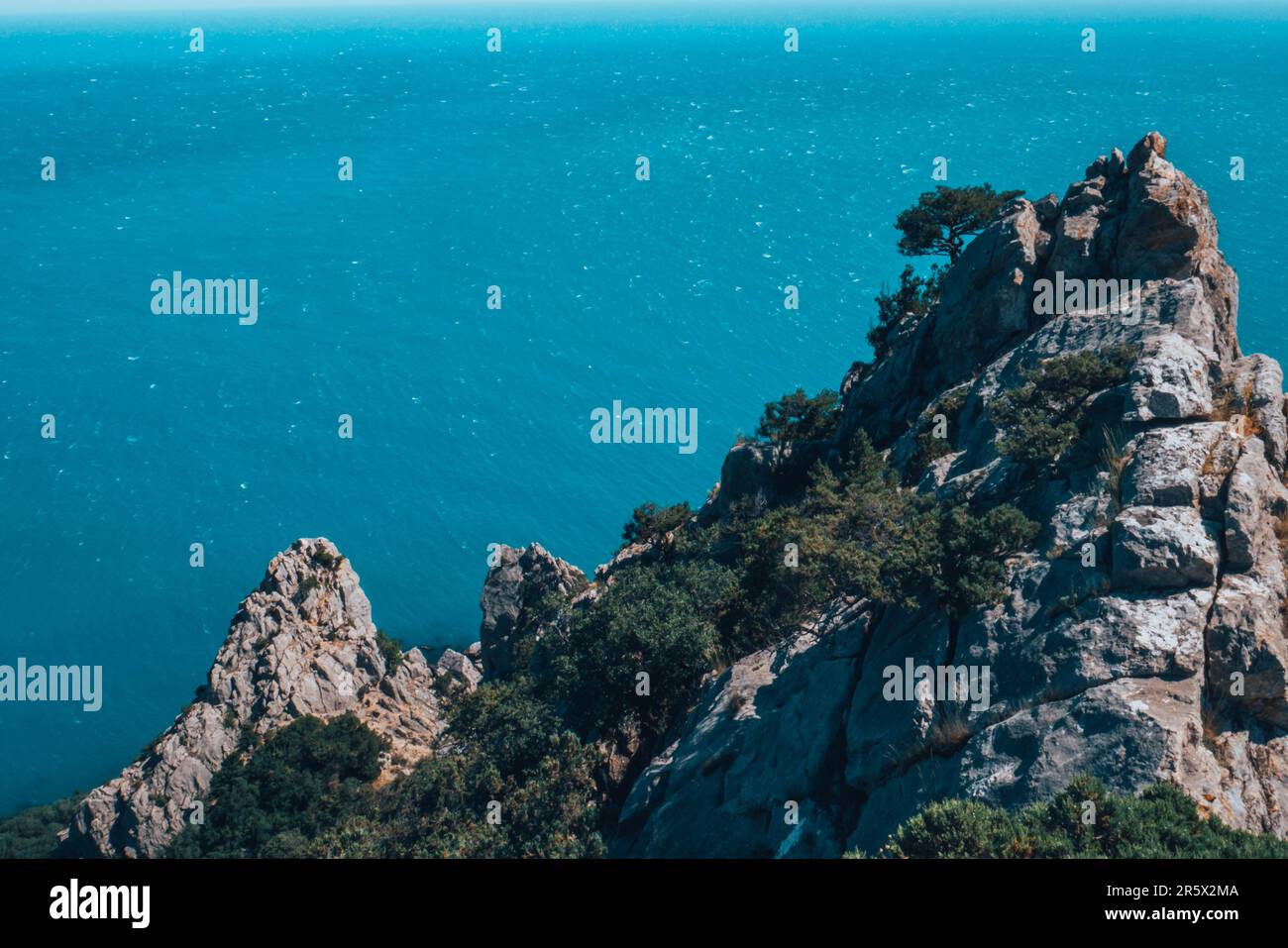 A large rock sticking out above the sea Stock Photo - Alamy