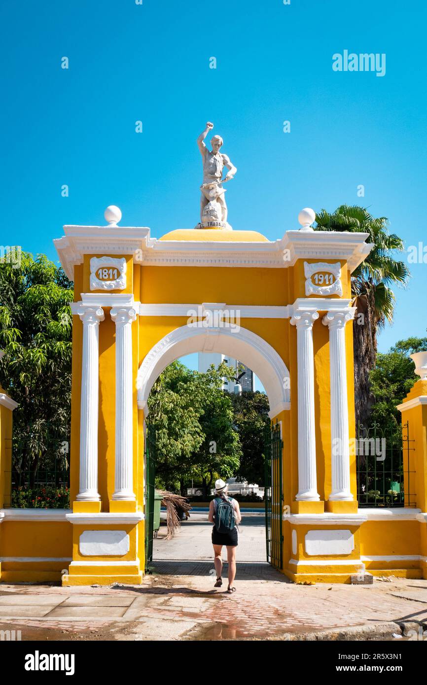 A Female Tourist Enters the Parque Centenario (centenary park) in Cartagena, Colombia Stock Photo