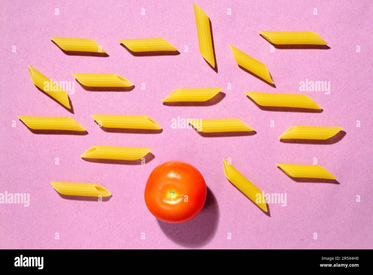 italian pasta named penne rigate and tomato, close up, italian food and