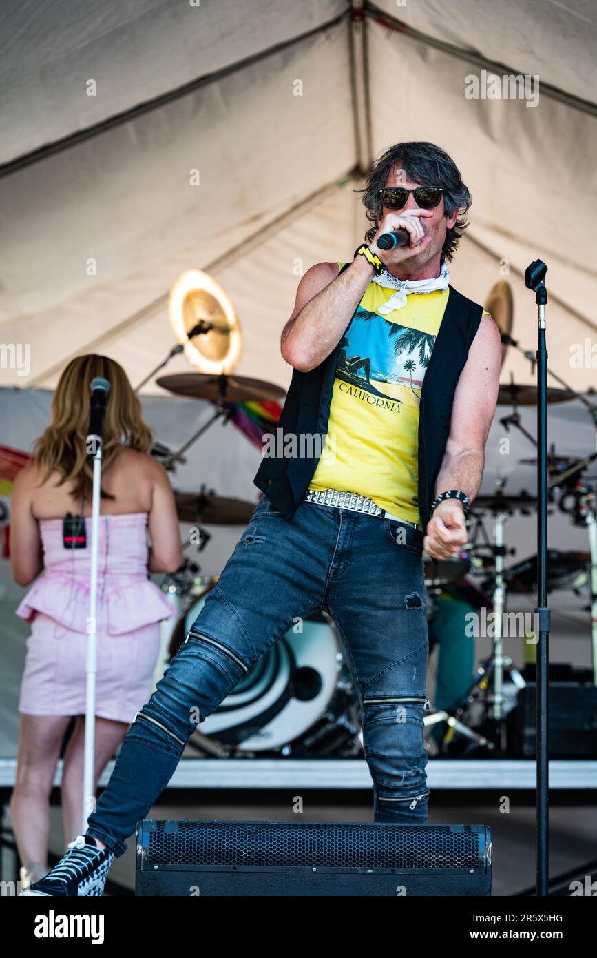 Alex Pels, lead singer of the 1980's cover band Tainted Love, performs as the headline act for the entertainment portion of Davis Pride. Stock Photo