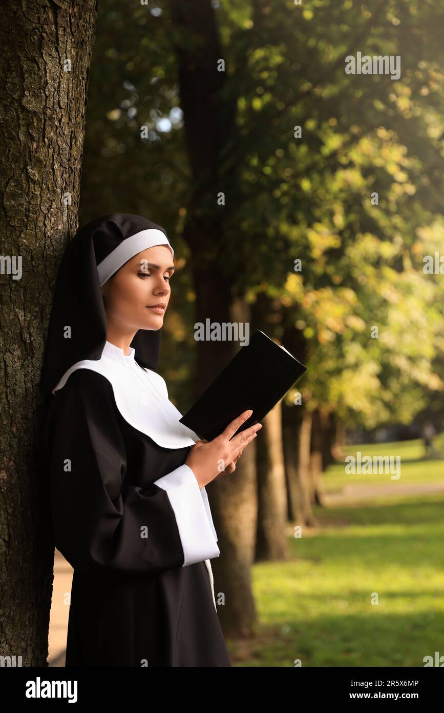 Young nun bible on hi-res stock photography and images - Alamy
