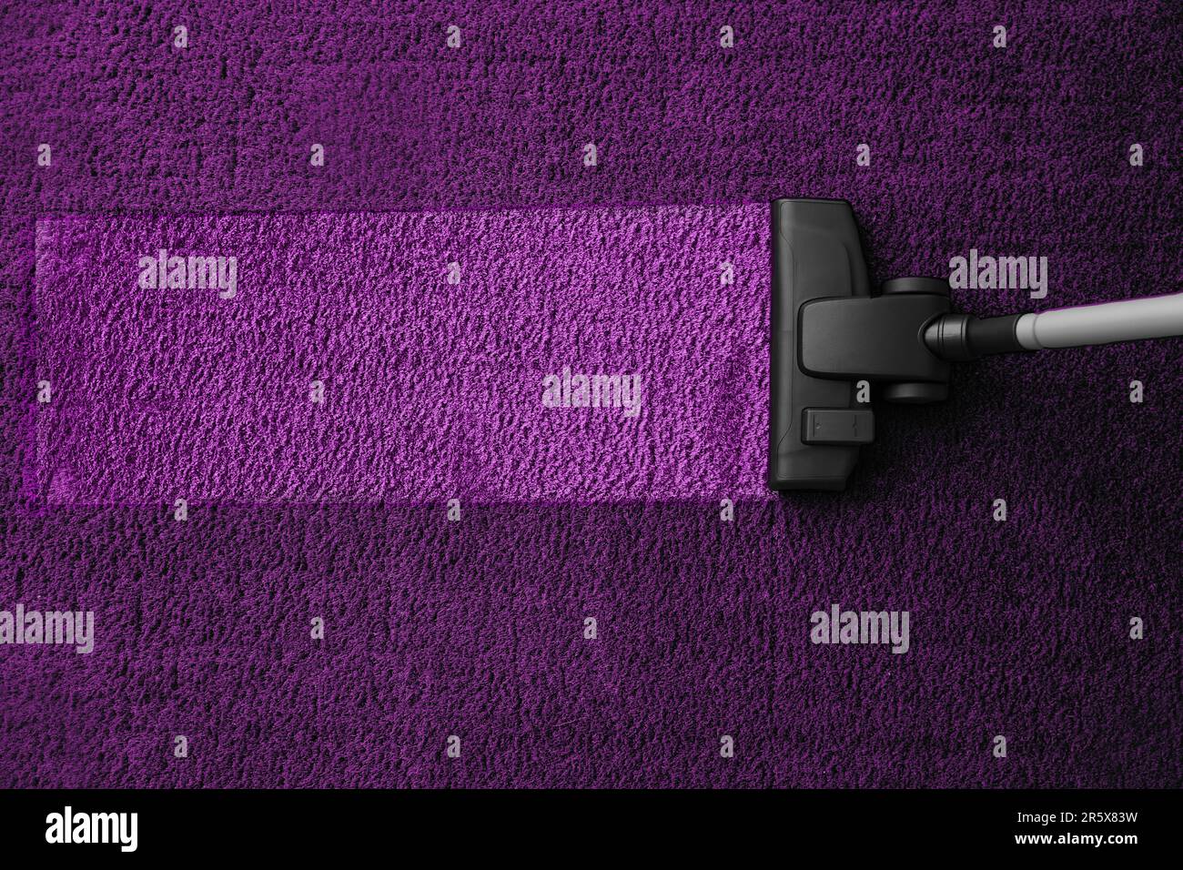 Vacuuming carpet. Clean area after using device, top view Stock Photo