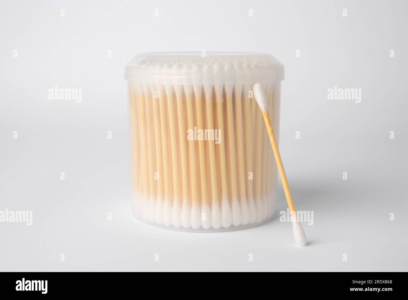 Many cotton buds in container on white background Stock Photo Alamy