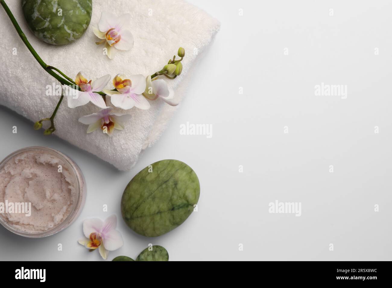 Flat lay composition with different spa products on white background ...