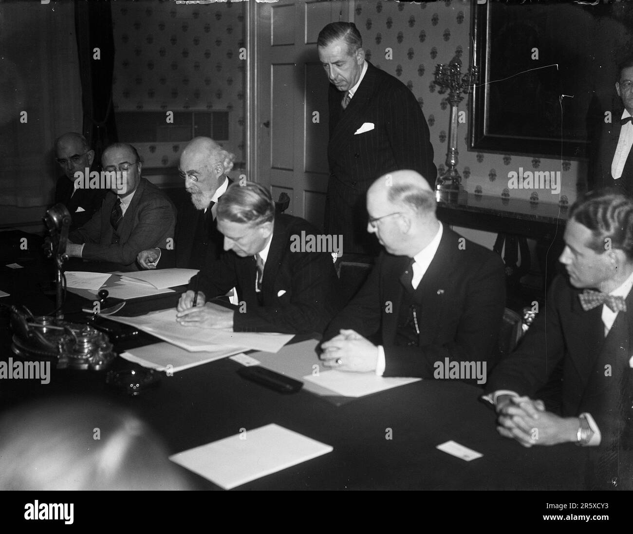 The Marshall Plan agreement between Holland and the USA being signed at The Haugue in 1948. The Marshall Plan was a very ambitious financial aid program proposed by US Secretary of State George Marshall. He understood that a destroyed and prostrate Europe had to have financial help if it were to recover and to remove the threat of communist insurgency. The aid was given not lent and each country decided on how it would use the funds. In the three years of the program the US gave Europe $13 billion, a colossal sum worth $175 billion at todays values. This far-seeing and generous plan was a majo Stock Photo