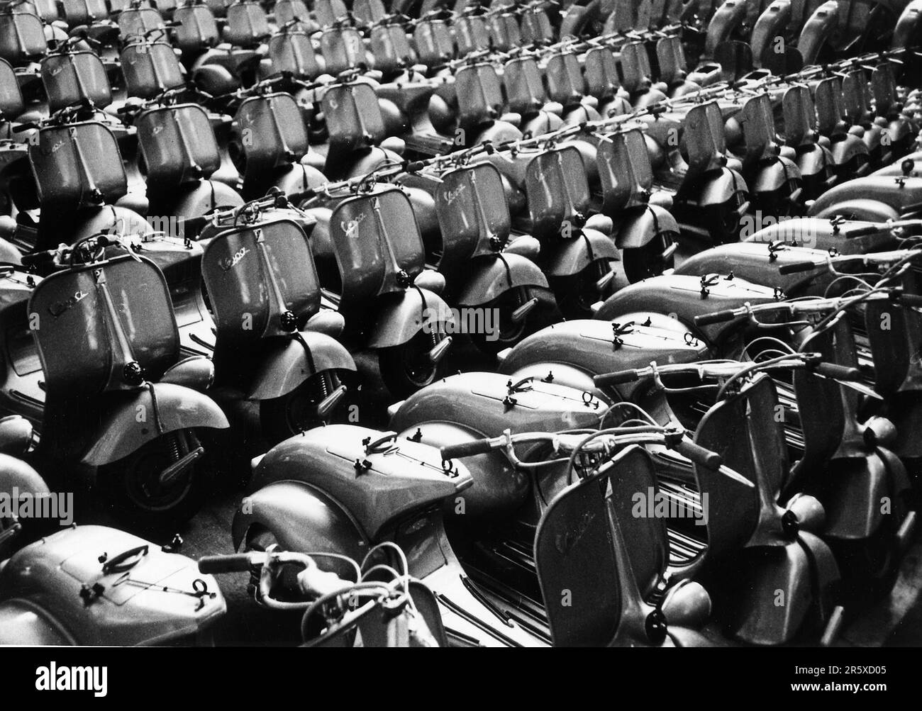 With the help of Marshall Plan funds, the Vespa Piaggio plant near Pisa starts to produce scooters. The Marshall Plan was a very ambitious financial aid program proposed by US Secretary of State George Marshall. He understood that a destroyed and prostrate Europe had to have financial help if it were to recover and to remove the threat of communist insurgency. The aid was given not lent and each country decided on how it would use the funds. In the three years of the program the US gave Europe $13 billion, a colossal sum worth $175 billion at todays values. This far-seeing and generous plan wa Stock Photo