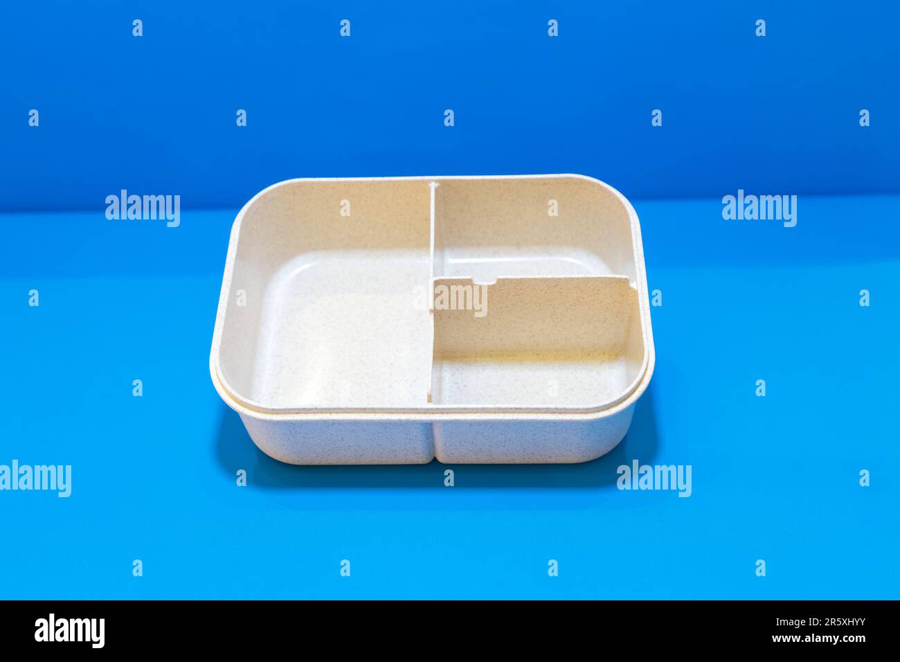 The White Lunch Box with Brown Lid and Three Compartments is a stylish