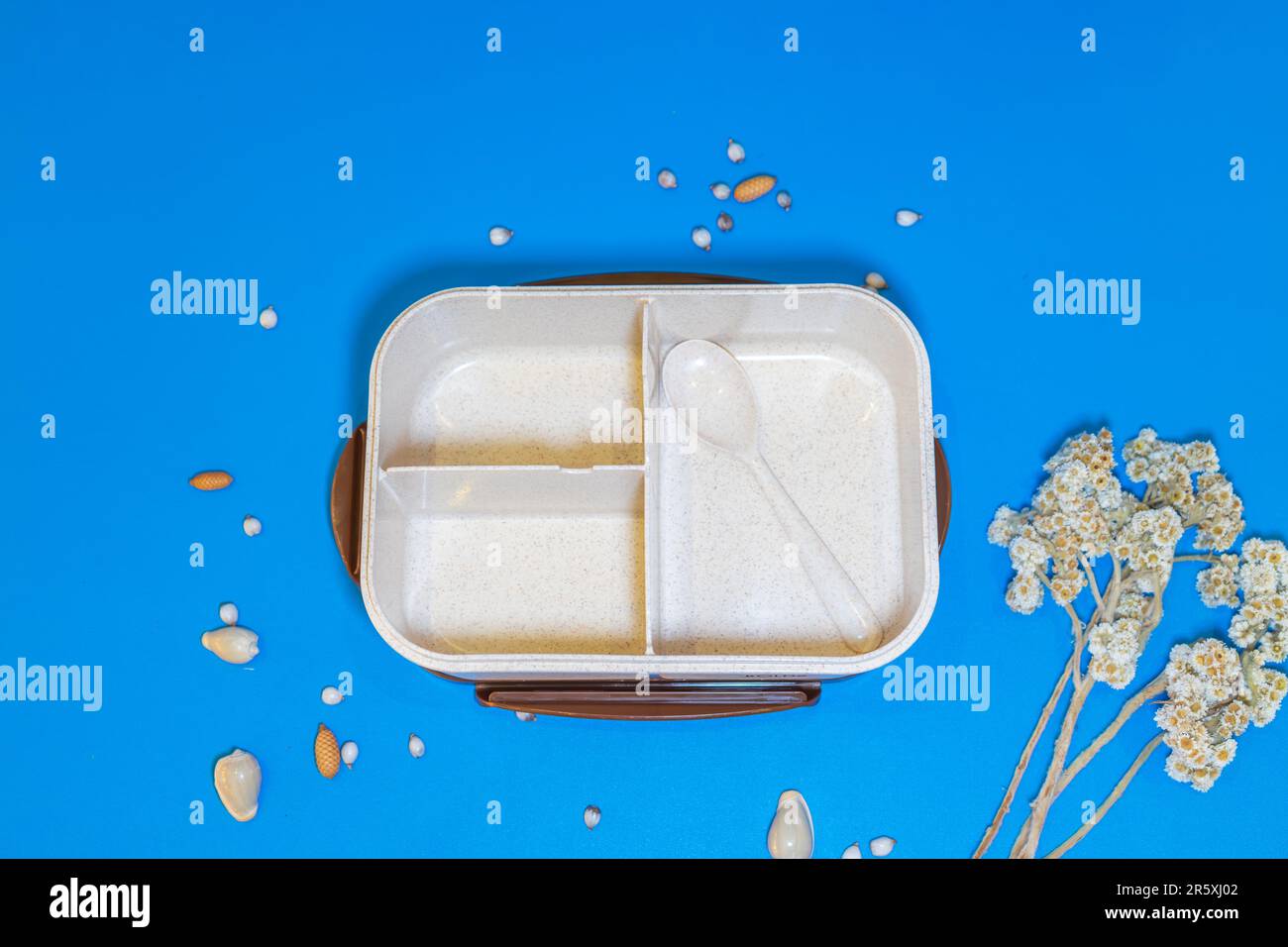 The White Lunch Box with Brown Lid and Three Compartments is a stylish