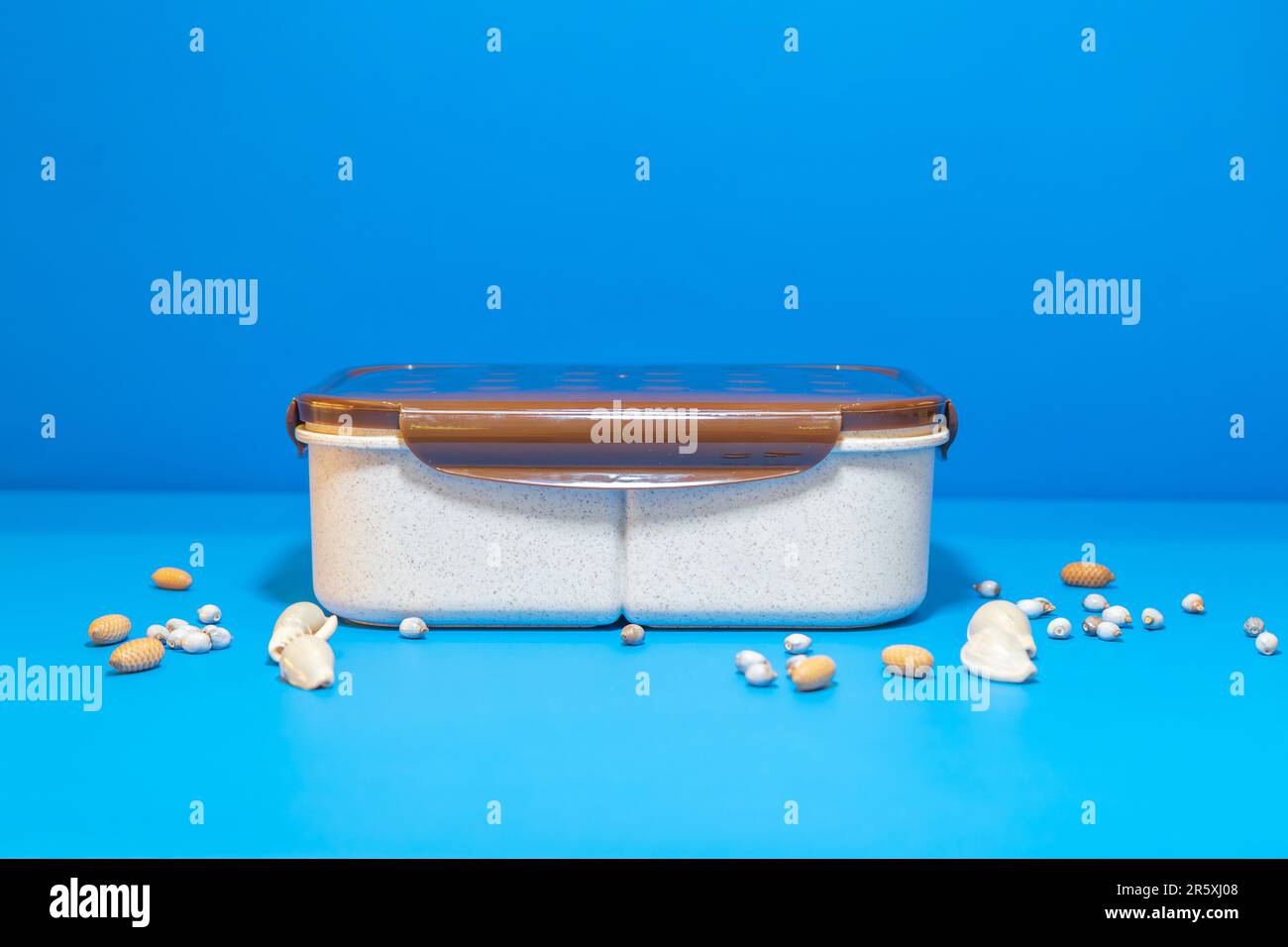 The White Lunch Box with Brown Lid and Three Compartments is a stylish