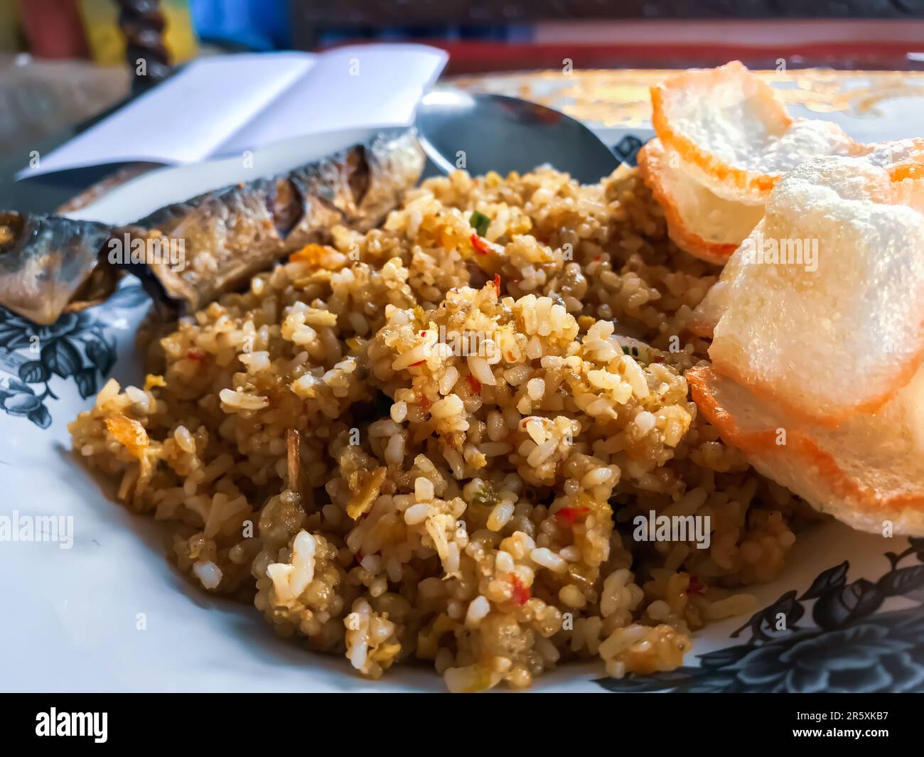 Fried rice with crackers and mackerel is a popular Indonesian dish that