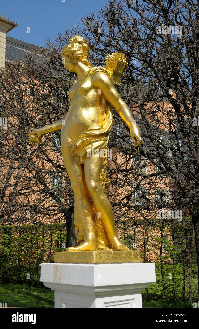 Schwetzingen, in spring, gilded figure in the palace garden, golden figure of the hunting goddess Diana Stock Photo