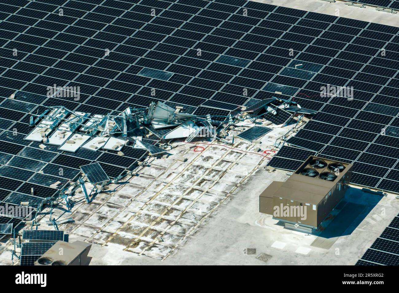 Aerial view of damaged by hurricane wind photovoltaic solar panels