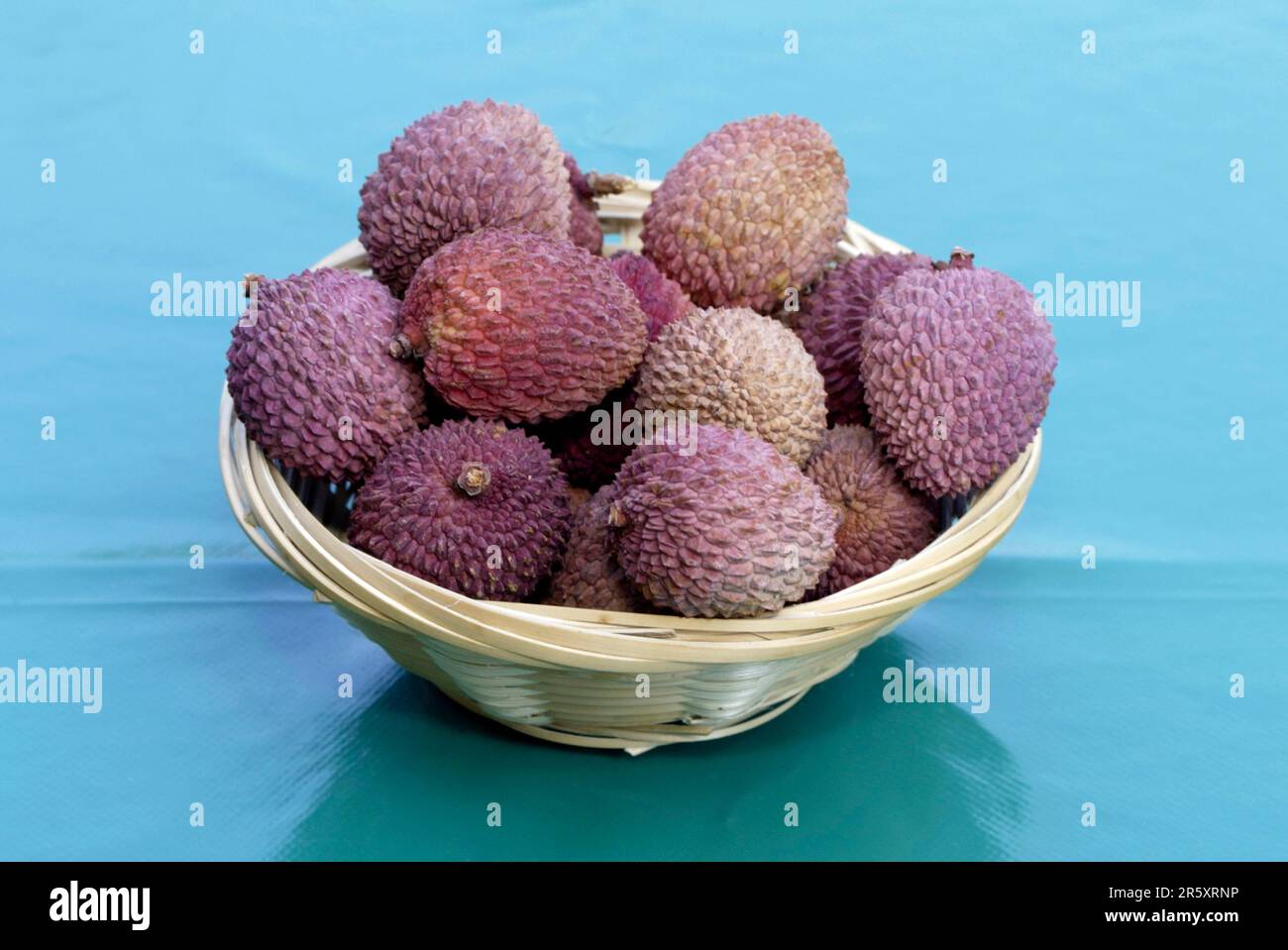 Lychee (Litchi chinensis) fruits in basket, Sapindaceae Stock Photo