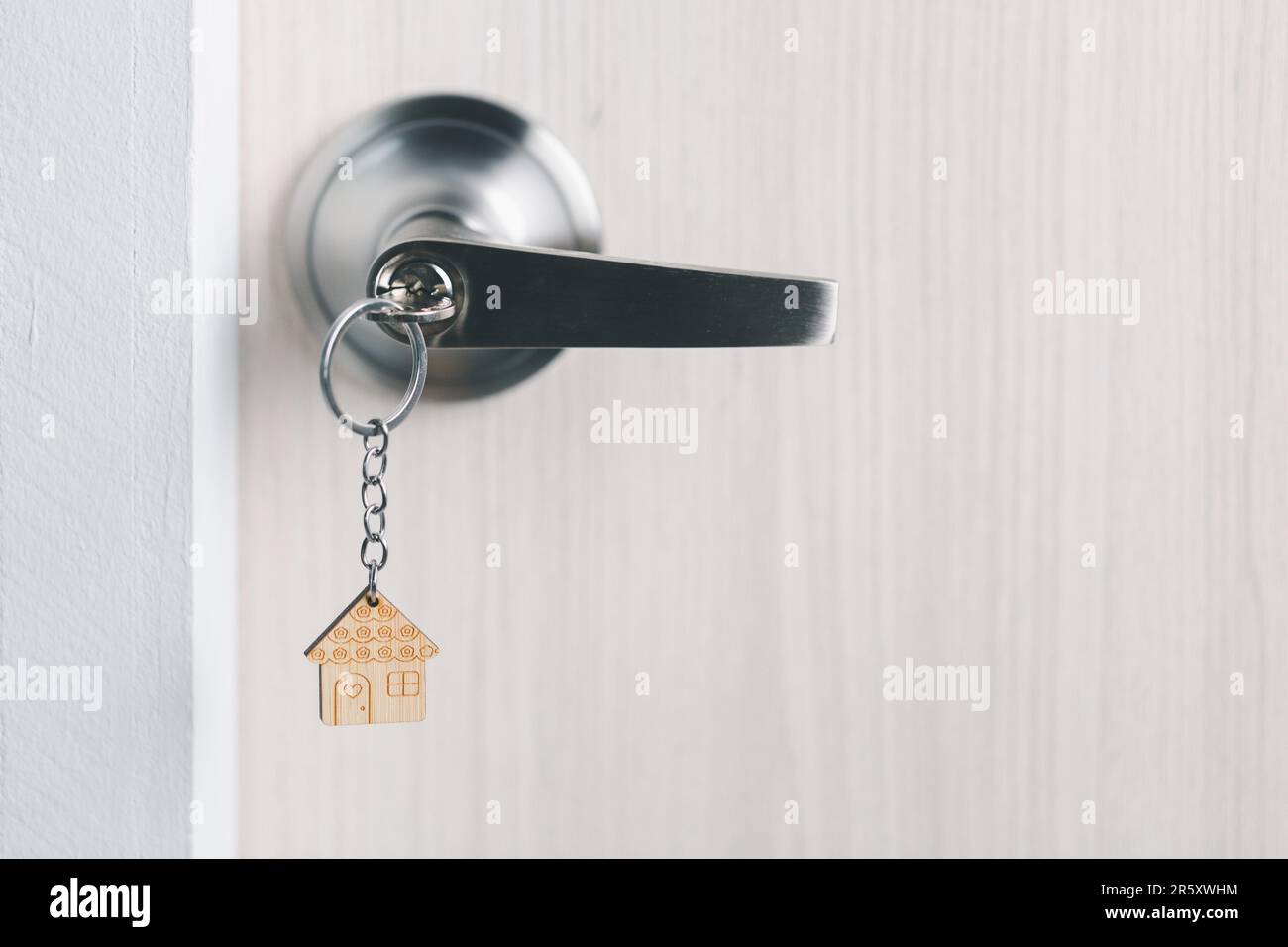 close up key on the door with morning light, personal loan concept