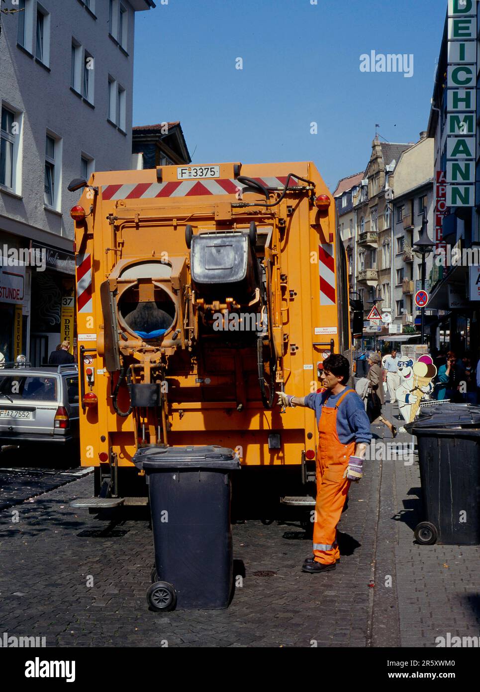Rubbish truck at work Stock Photo Alamy
