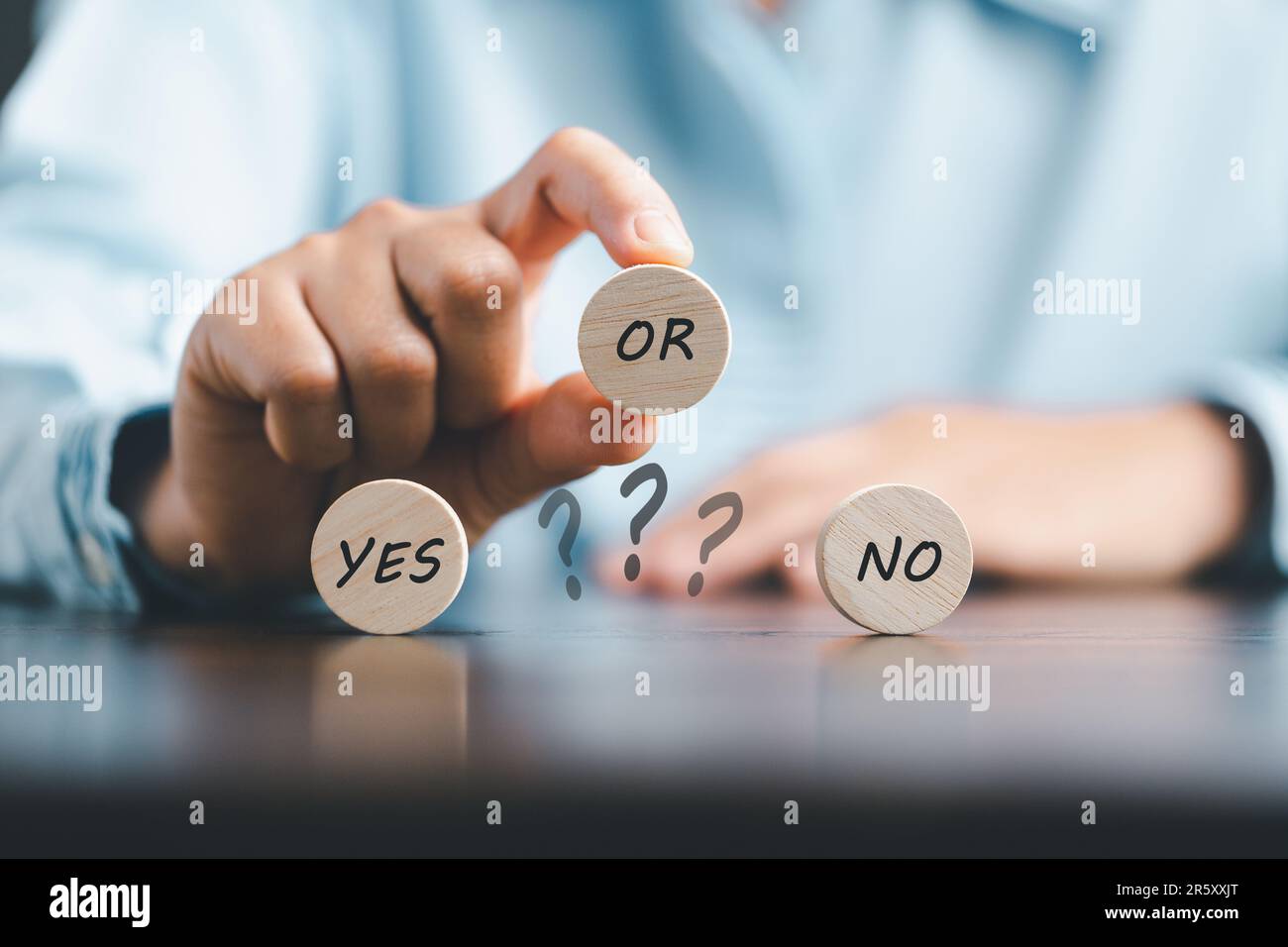 Concept of choice yes on wooden cubic blocks. Think with Yes or No choice, Business choices for difficult situations, Business woman hands with wooden Stock Photo