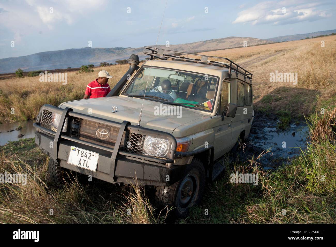 Stuck car, North Serengeti, Serengeti National Park, Tanzania, Toyota Landcruiser Stock Photo