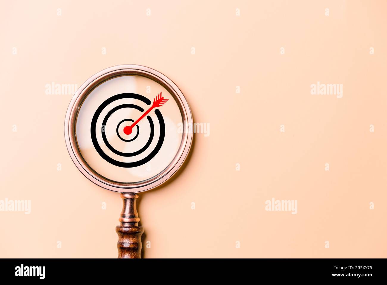 Target board inside vintage magnifying glass for focus business