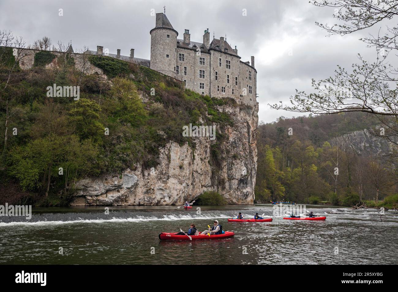Castle, Chateau de Walzin, below river Lesse with canoeists, province Namur, region Dinant, Belgium Stock Photo