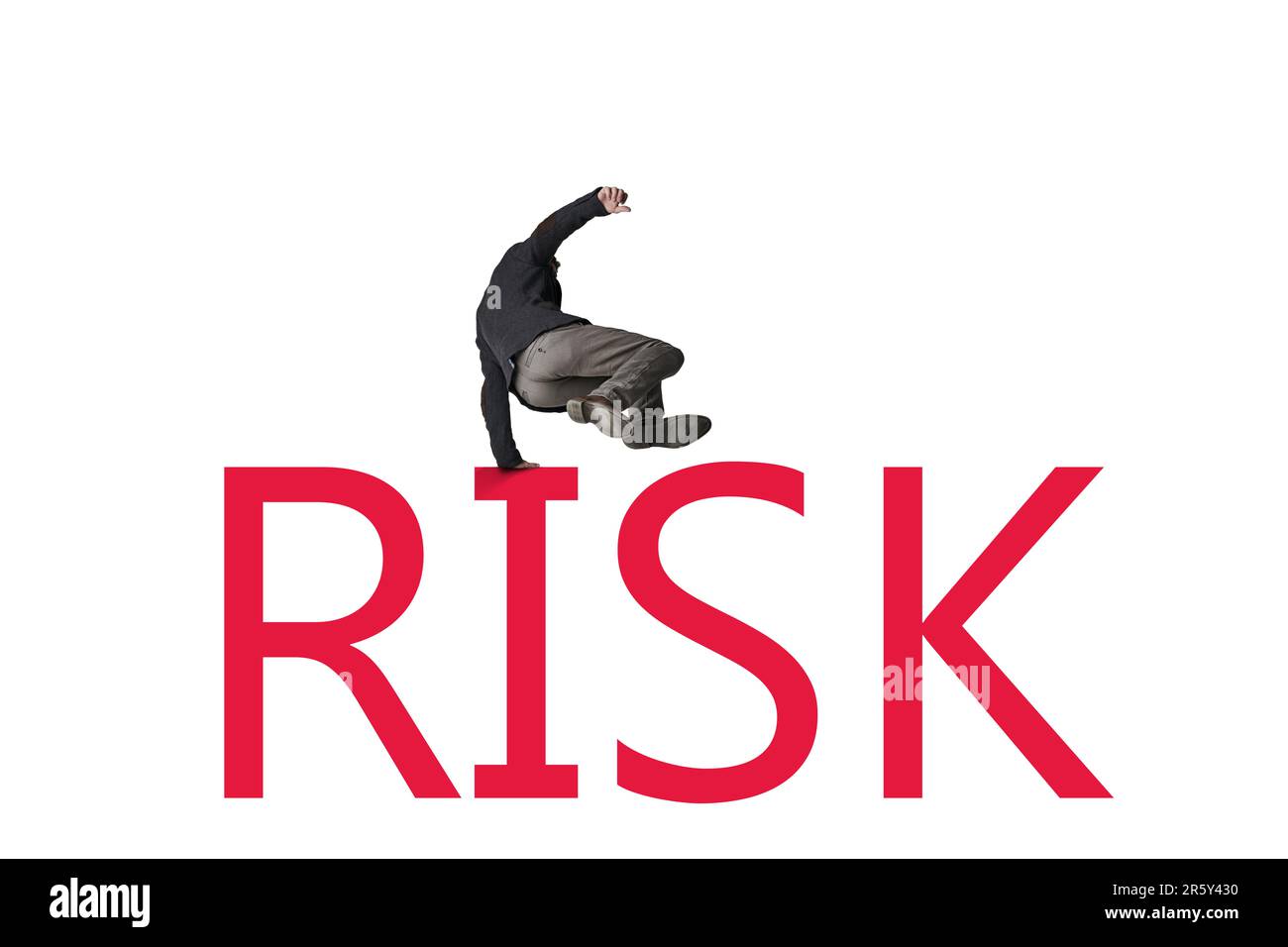 The bigger the risk, the bigger the leap of faith. a businessman jumping over the word RISK against a white background. Stock Photo