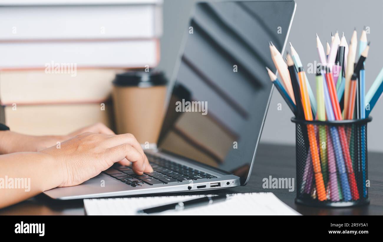 Education concept. Close up of female student make notes hand typing in ...