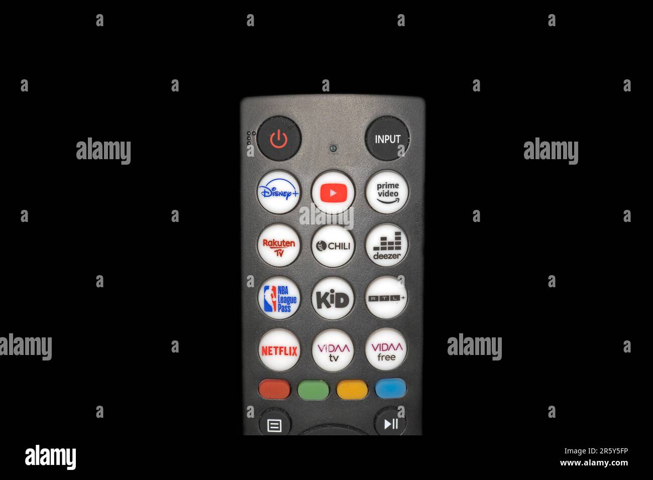 Close-up of a TV remote control with extra buttons for pre-programmed programmes, studio photography with black background Stock Photo