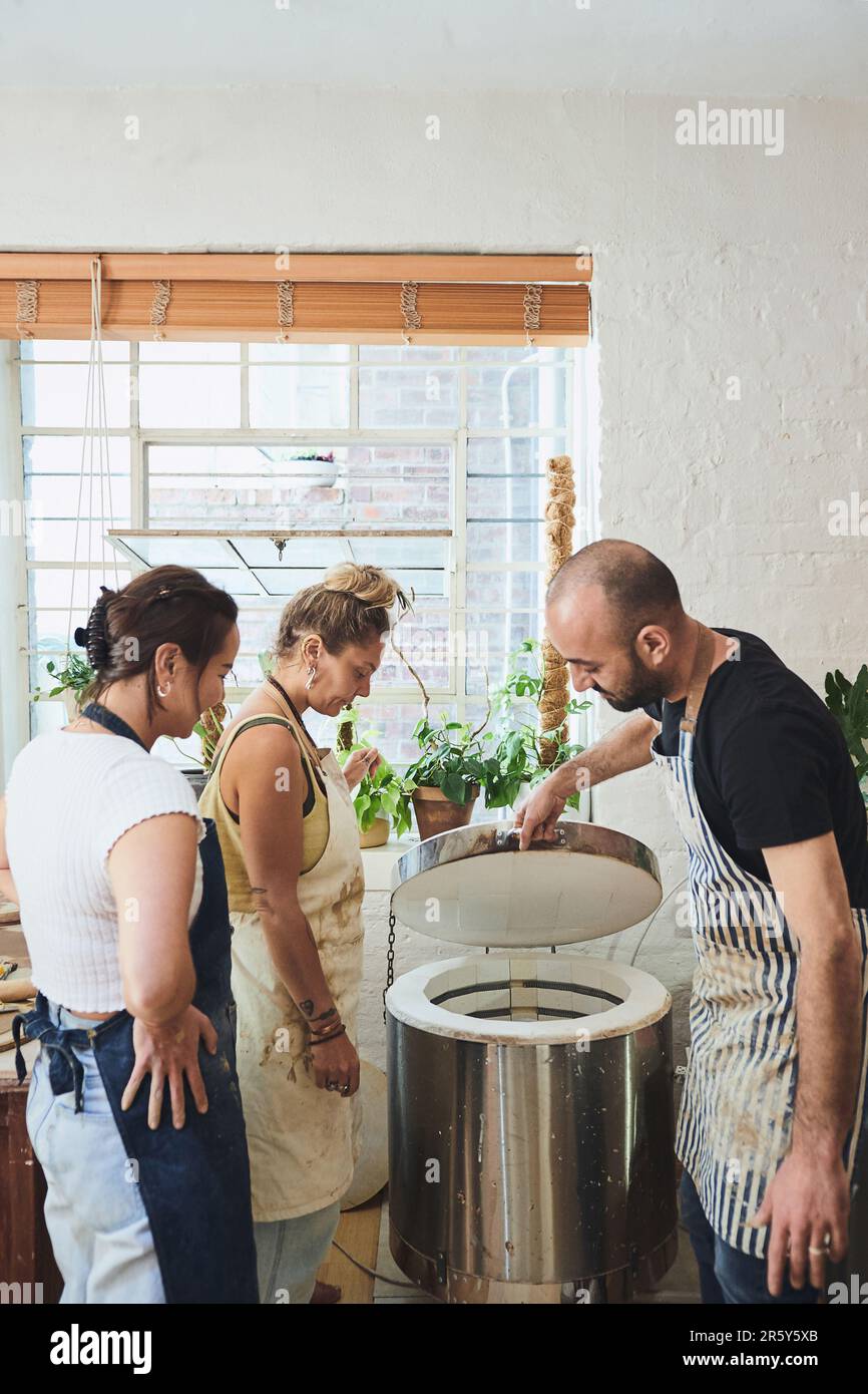 Skilled potters with a license to kiln. a group of young people using