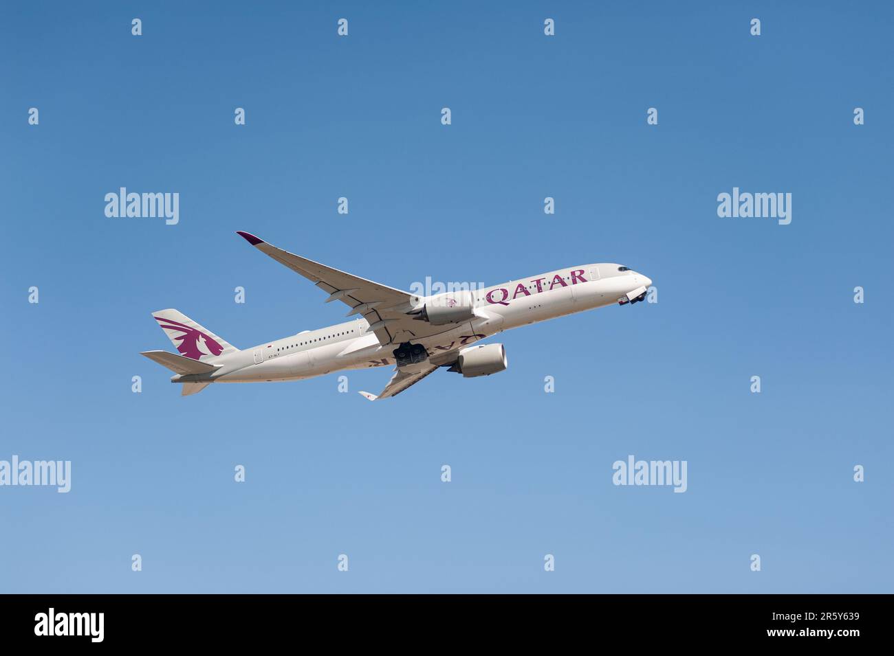 04.06.2023, Berlin, Germany, Europe - A Qatar Airways Airbus A350-900 passenger aircraft takes off from Berlin Brandenburg Airport BER. Stock Photo