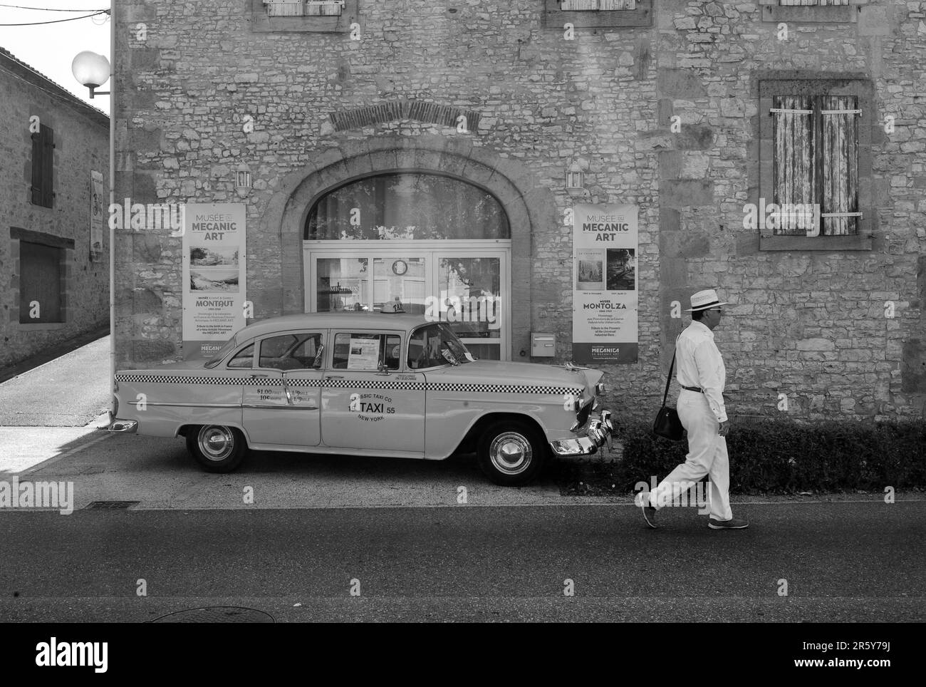 White dressed man and retro New York cab, Cazals, Lot department, France Stock Photo