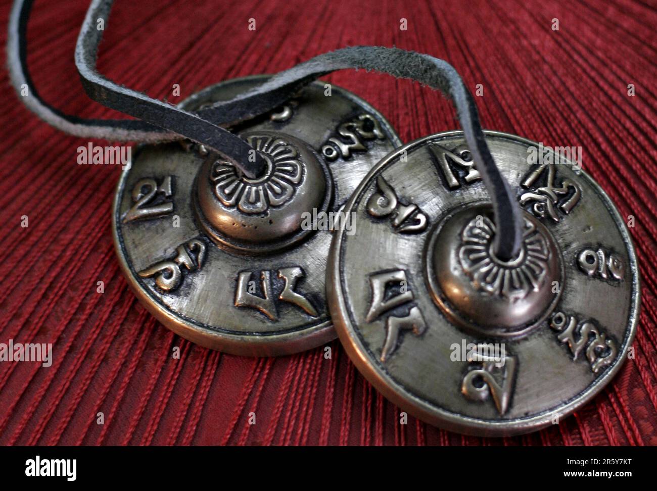 Tingshas are small cymbals used in prayer and rituals by Tibetan Buddhist practitioners. Stock Photo