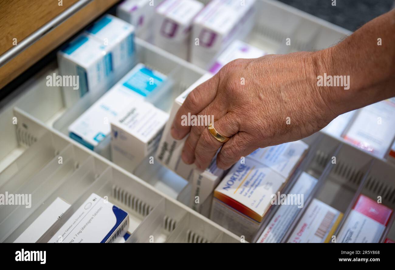 Berlin, Germany. 05th June, 2023. A pharmacist retrieves a medication