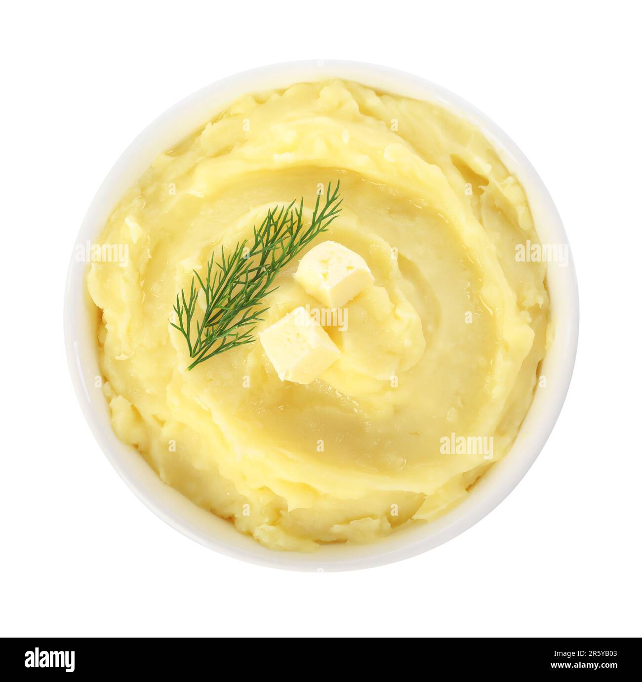 Bowl of delicious mashed potato with dill and butter isolated on white, top view Stock Photo