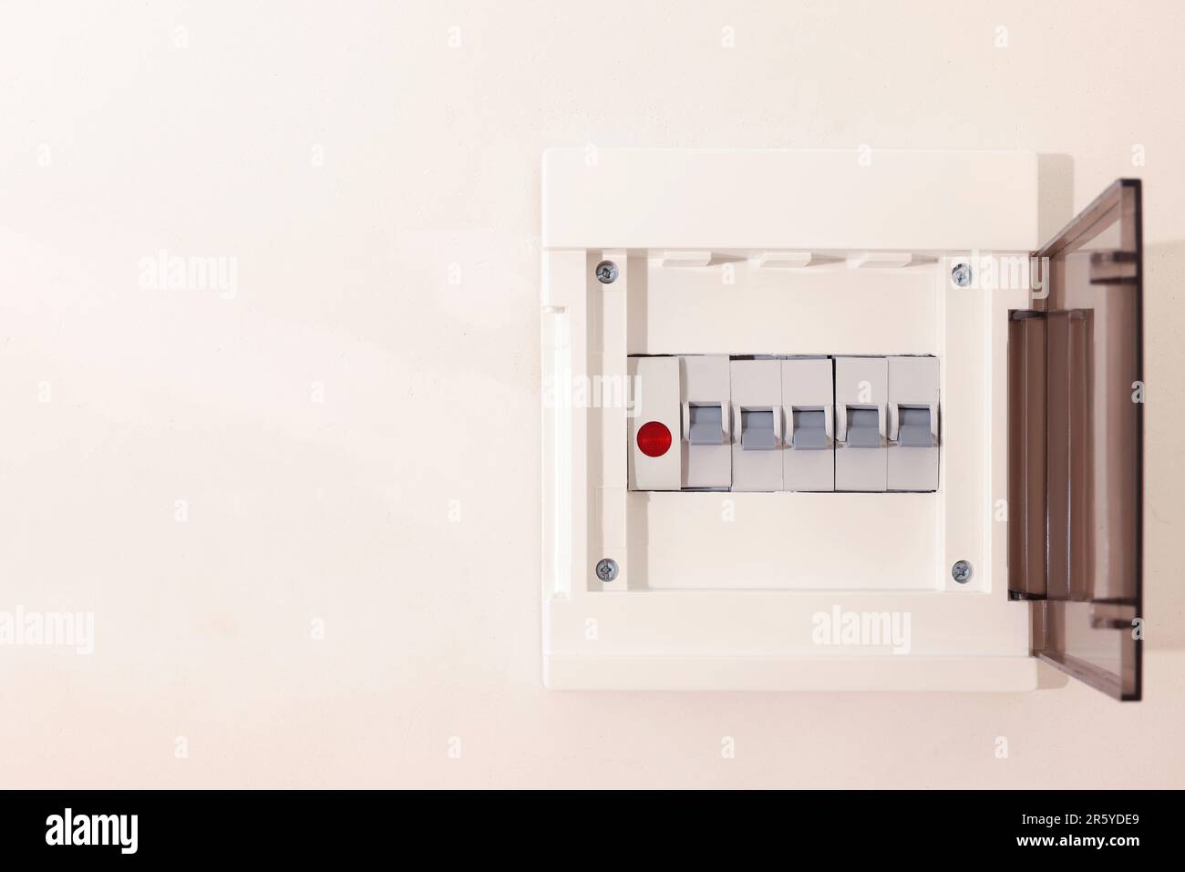 Open fuse box on beige wall. Space for text Stock Photo Alamy
