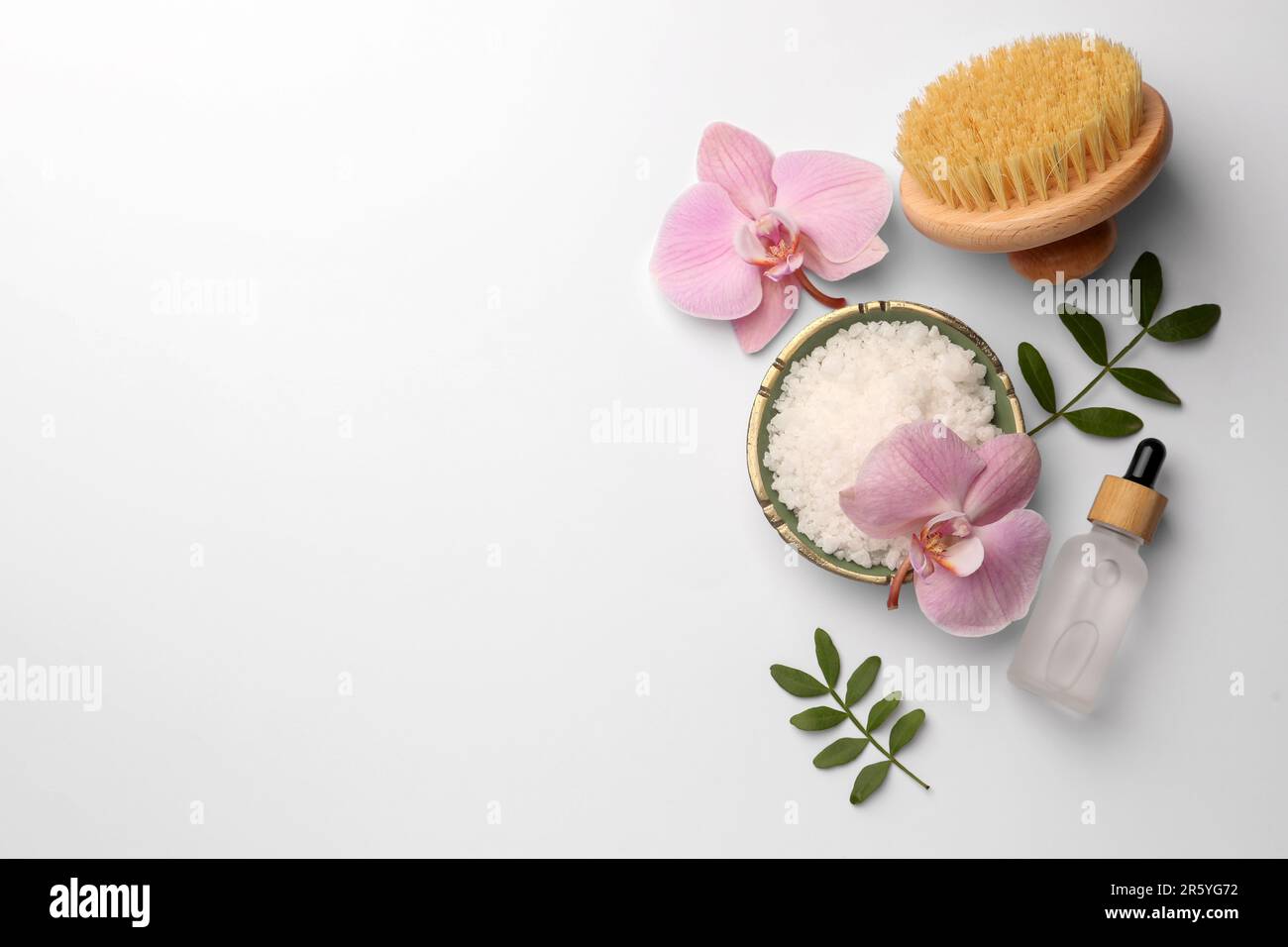 Flat lay composition with different spa products on white background ...
