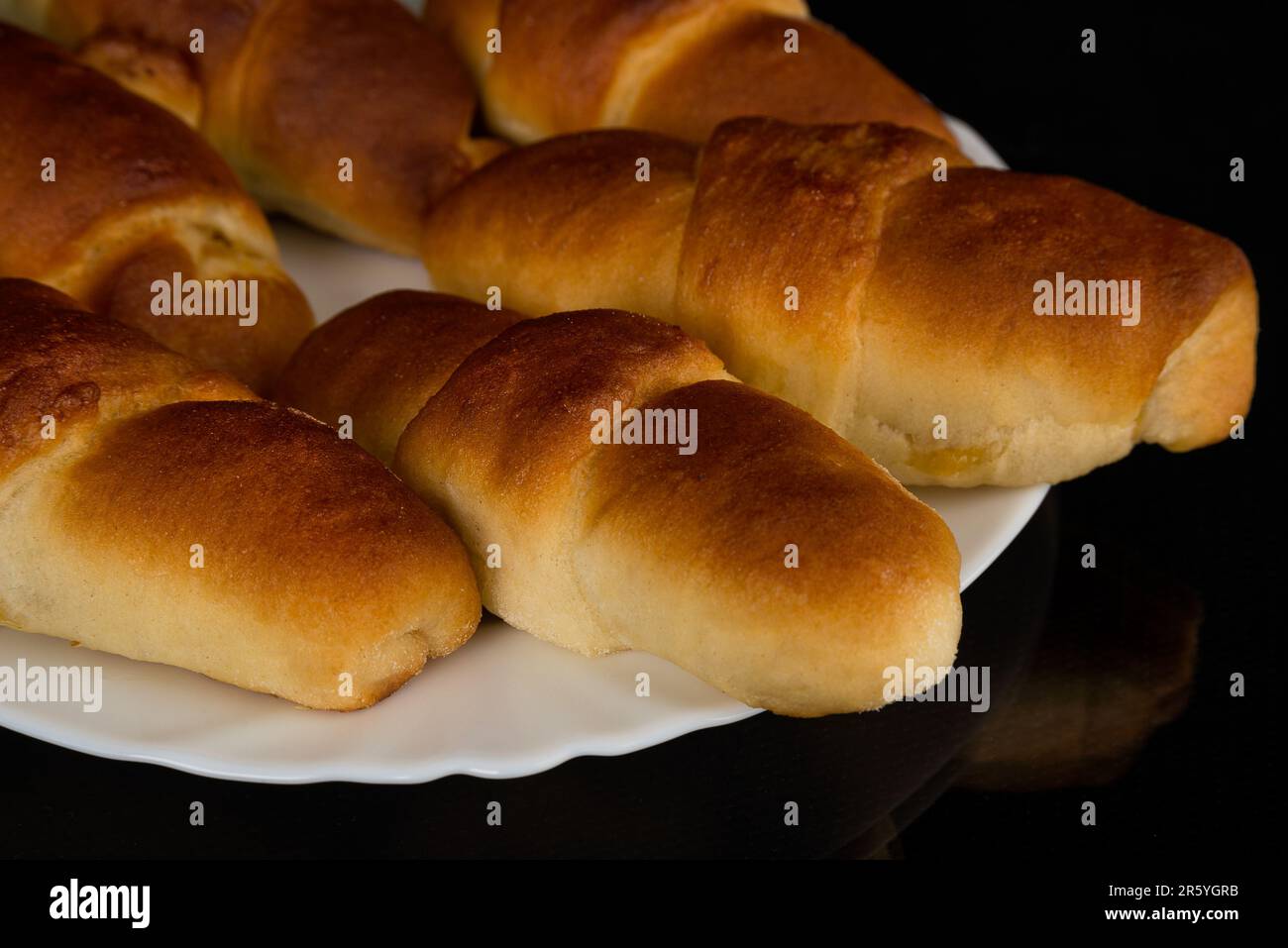 Croissant shaped Breakfast Pastry with a poppy seed stuffing Stock