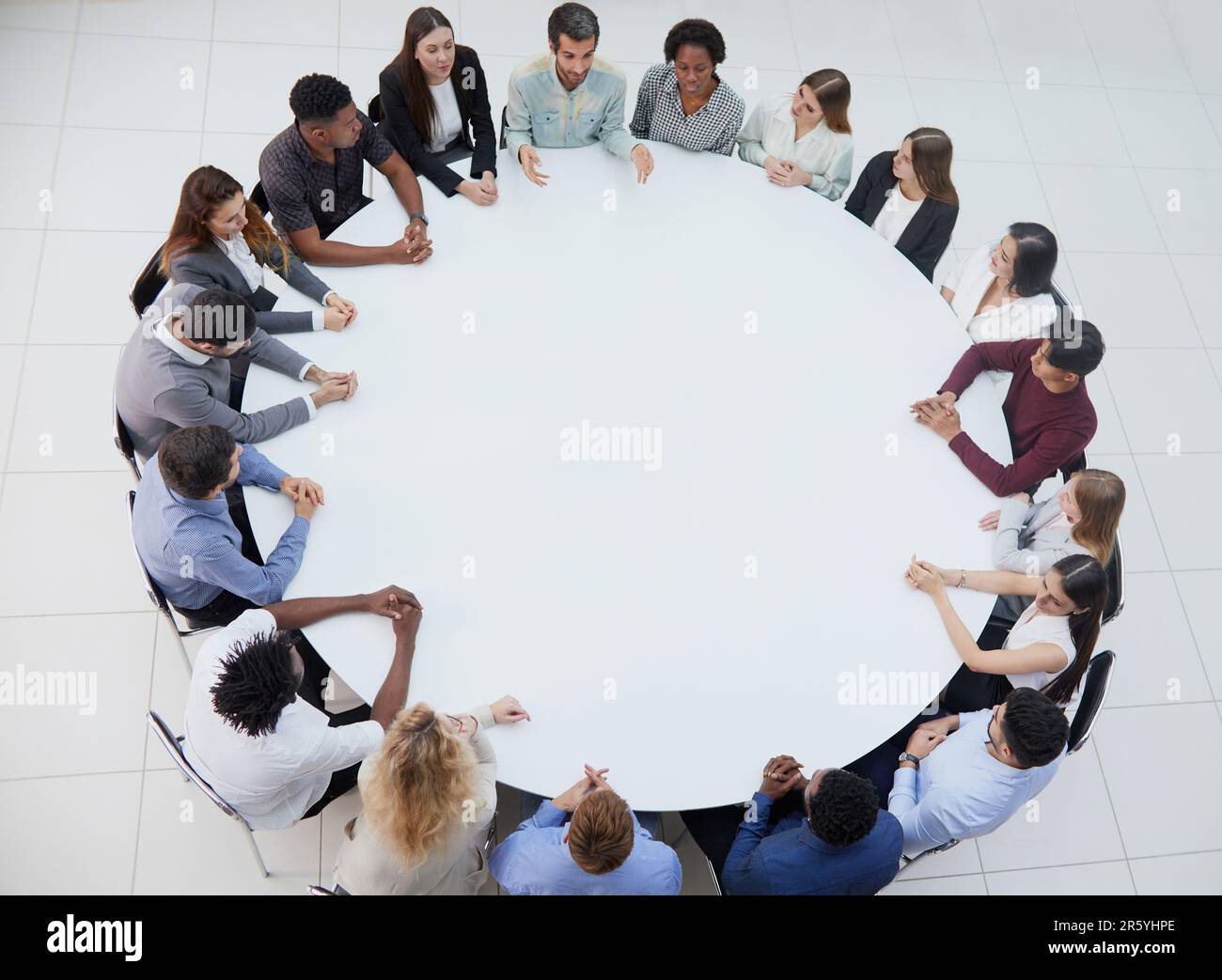Business people having a meeting at round table Stock Photo Alamy