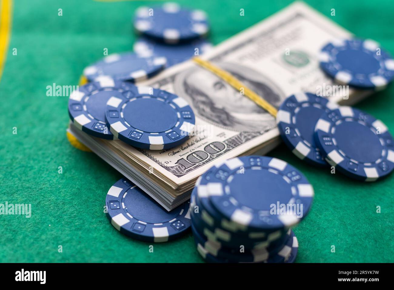 Poker chips and dollar Money bills on green cloth Stock Photo Alamy